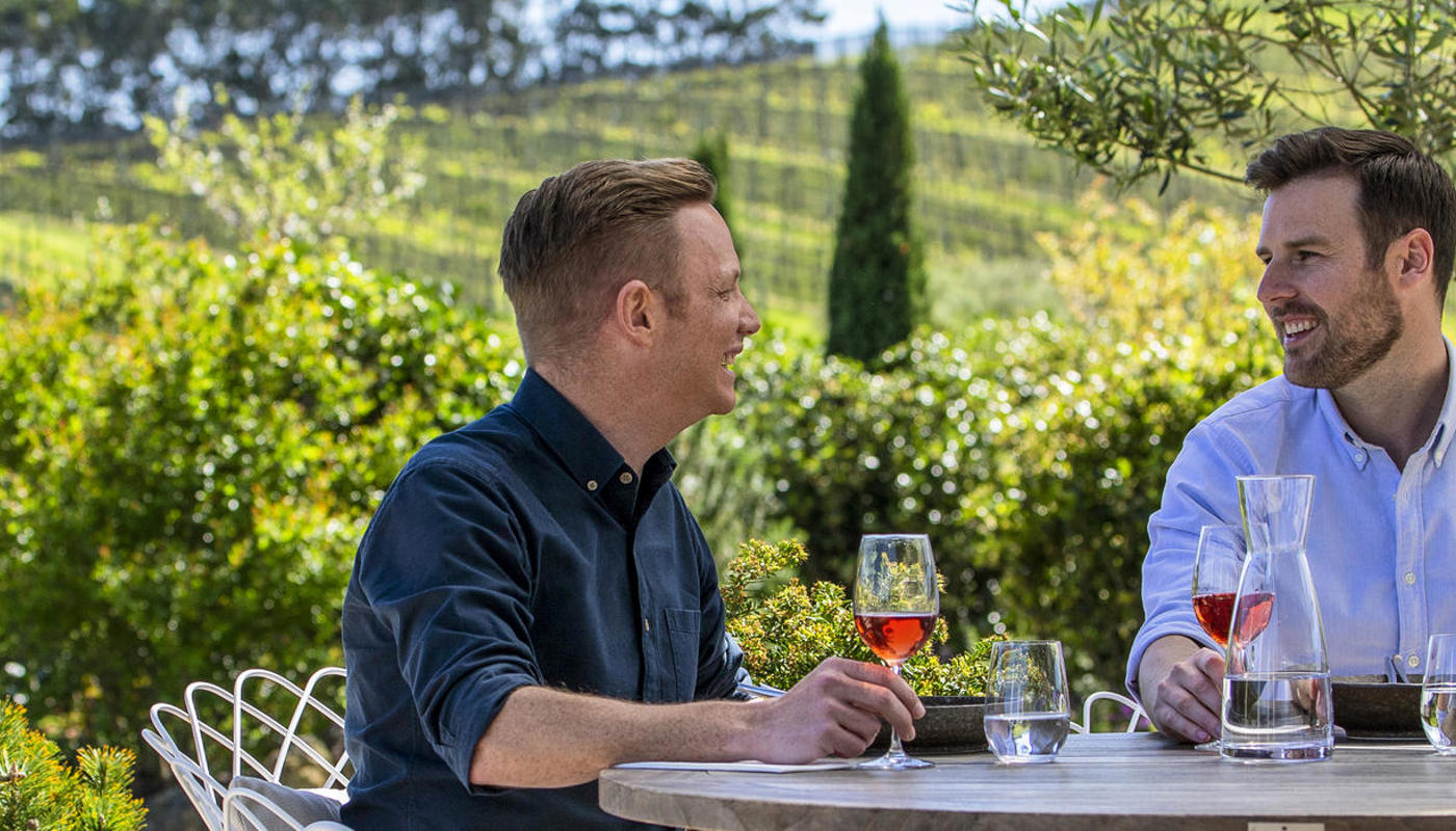Men enjoy lunch at Tantalus Vineyard on Waiheke Island
